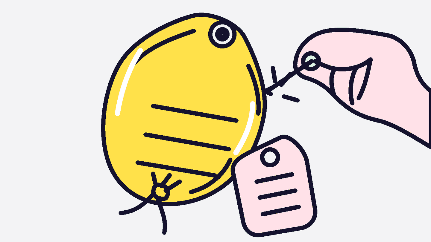 Inflated blank price tag about to be popped by a pin, with a smaller flat blank tag beside it.